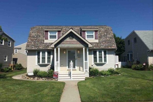 Megan's Vacation home with her roof install complete in the shingle color Sand Dune