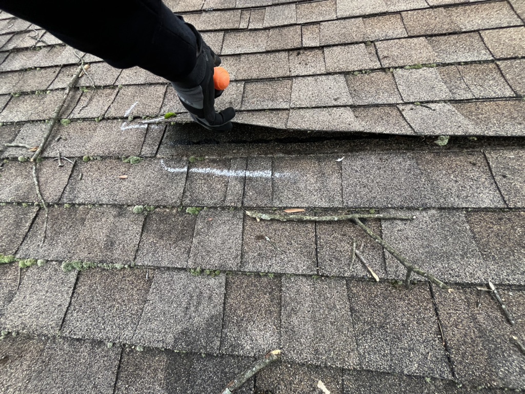 Lift upped shingle that is damaged